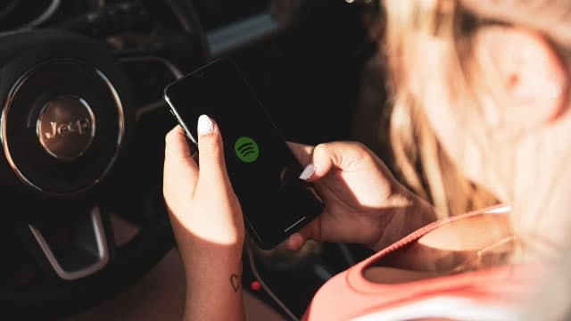 Spotify shares rise on record royalty payout