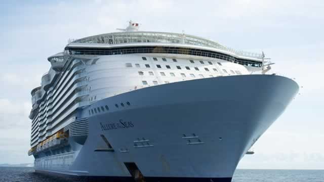 10 side-by-side photos show how a Royal Caribbean cruise ship transforms with colorful lights at night