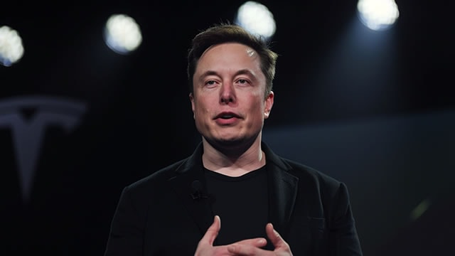 Tesla drops as mounting headwinds test lofty valuation