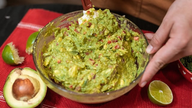 Chipotle lifts its sales forecast even as a lettuce-linked outbreak slows foot traffic